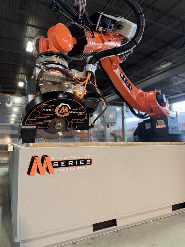 BACA Robo SawJet M Series 240 mitering quartzite slab on cutting table for stone countertop fabrication